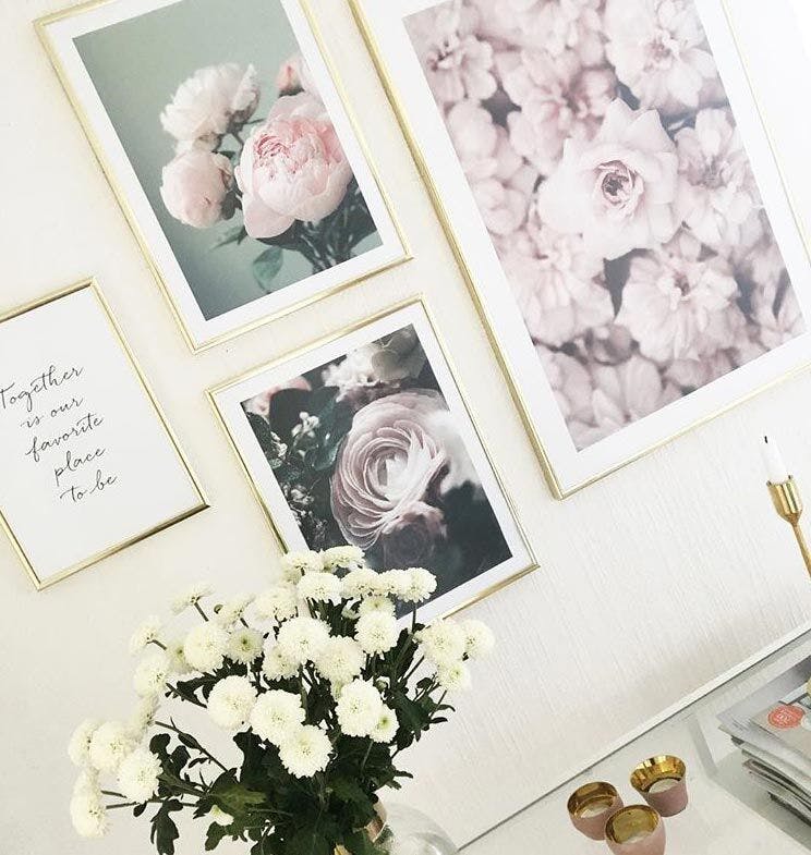 Delicate photo wall in pink tones with peonies
