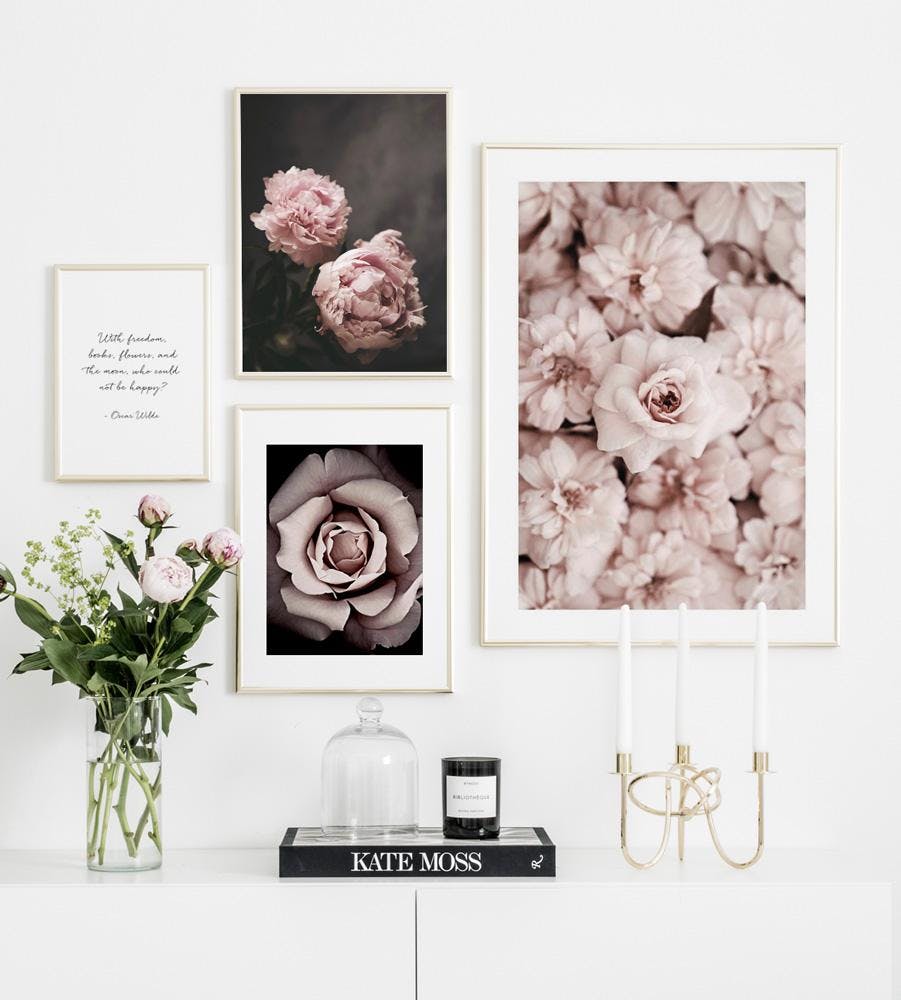 Gallery wall with flowers posters in gold frames