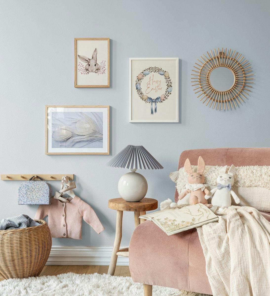 Pastel-coloured easter gallery wall with illustrations and photographs with white wood and oak frames for the kid's room