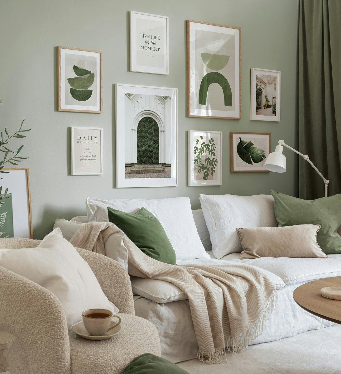 Modern gallery wall in green of graphic, quotes and architecture posters with oak and white wood frames for living room