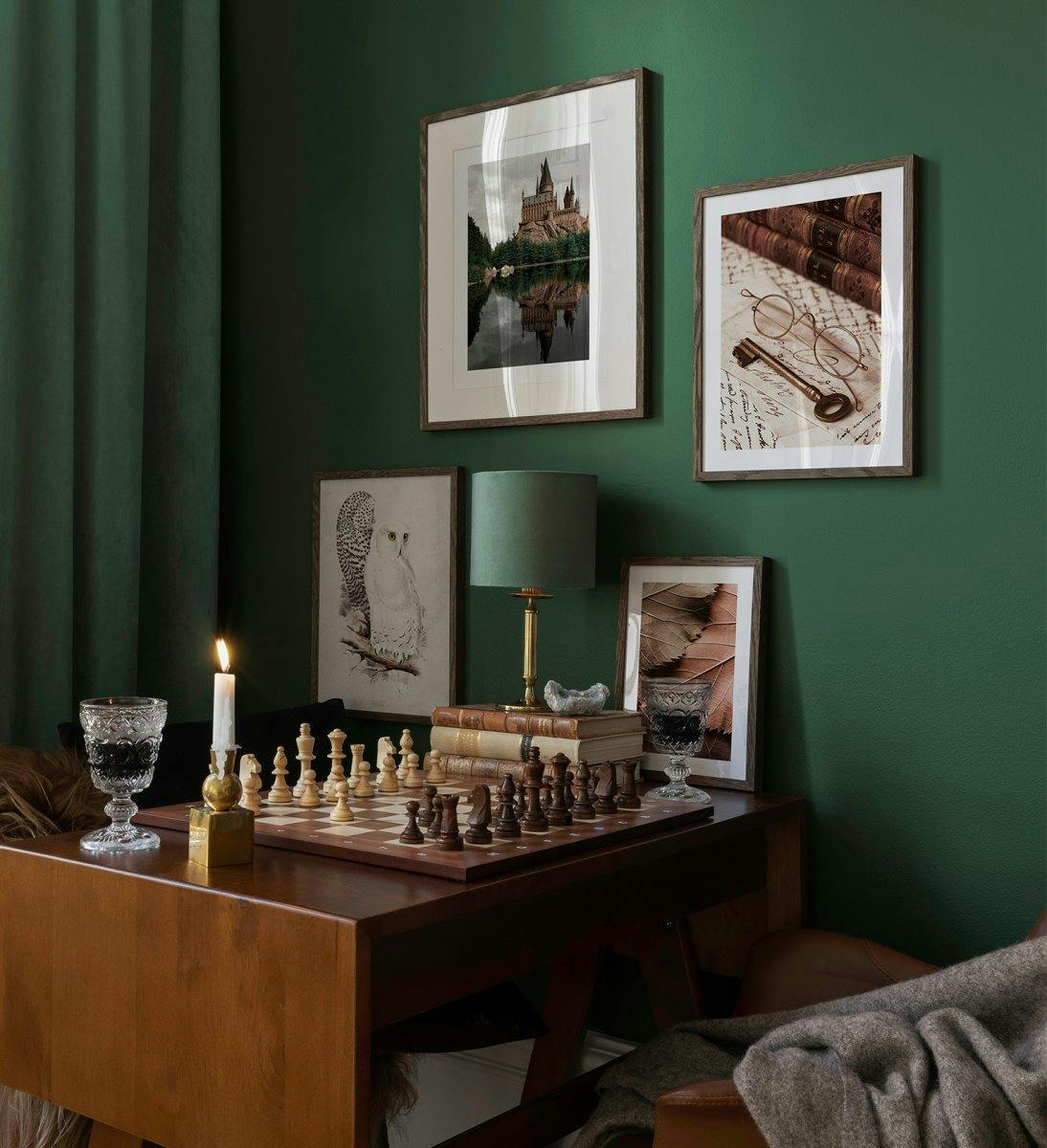 Gallery wall with dark wood frames and prints inspired by the magical woods for the gaming room or living room