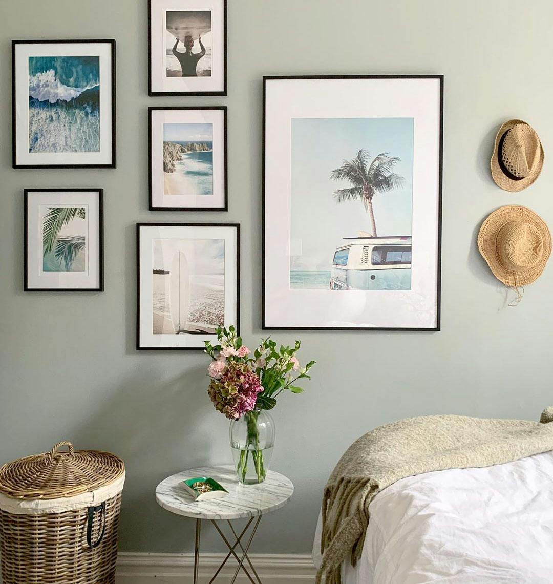 Gallery wall with beach prints in walnut frames