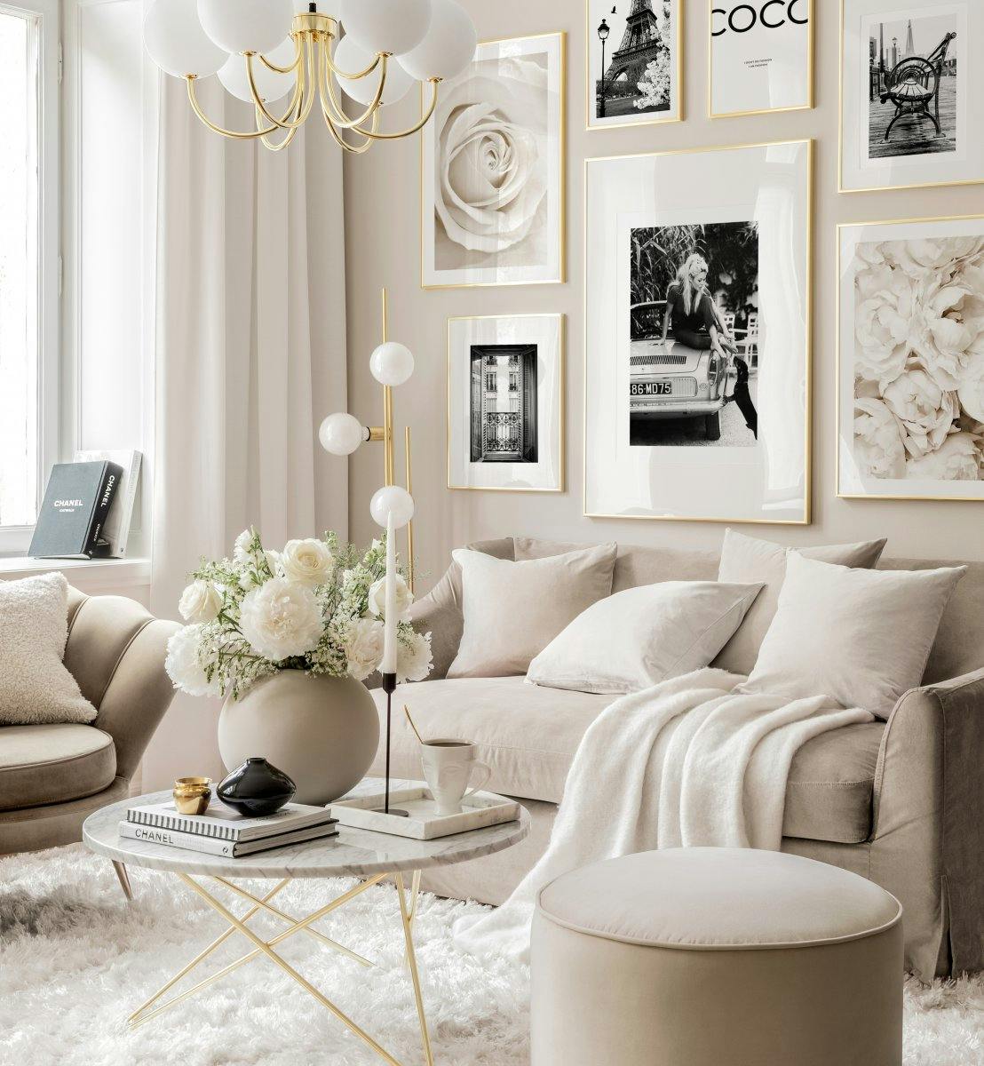 Romantic black and white gallery wall beige living room Brigitte Bardot posters golden frames
