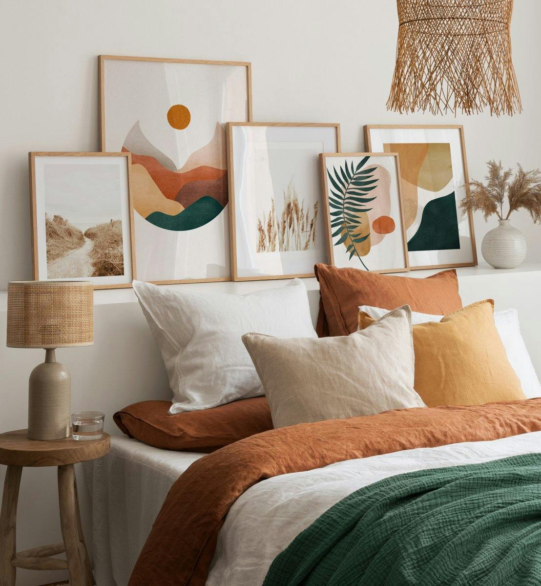 Graphic art prints, illustrations, and photographs in earthy tones for a bedroom