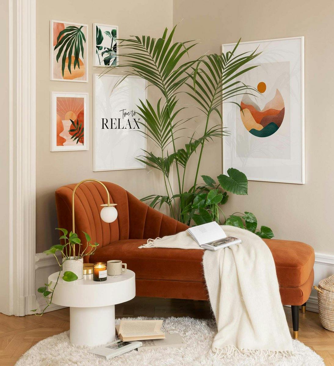 Graphic gallery wall in eye-catching orange and green colours for the living room