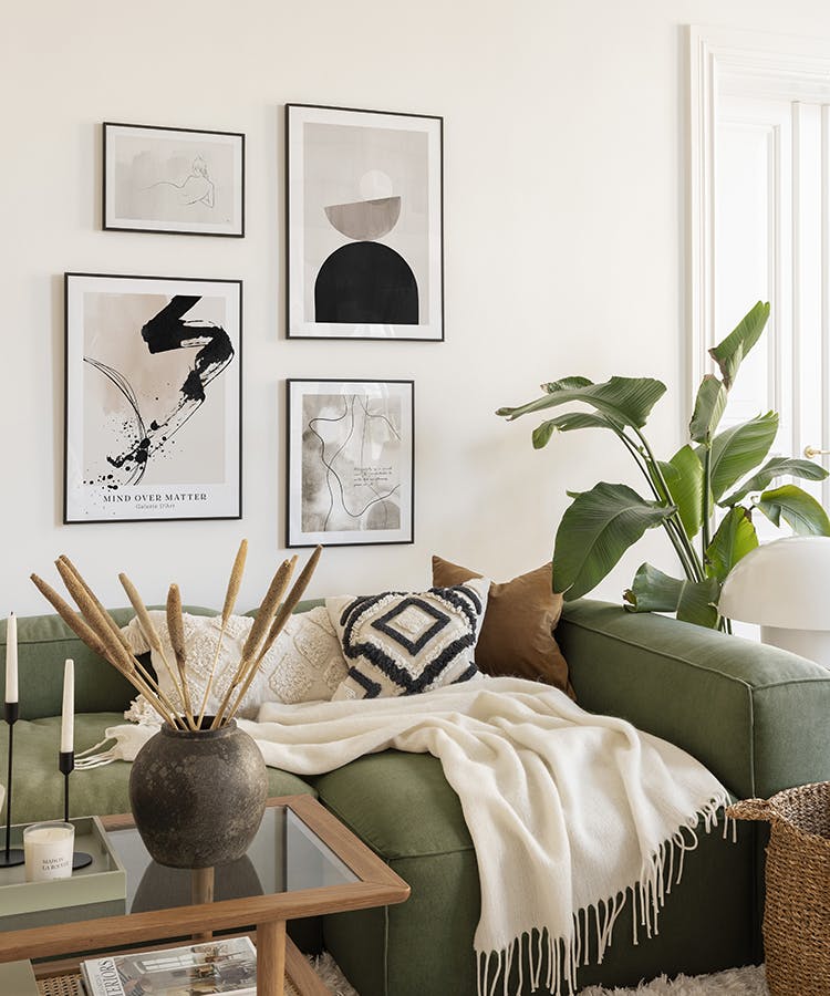 Abstract and modern gallery wall in beige and black with black metal frames for bedroom