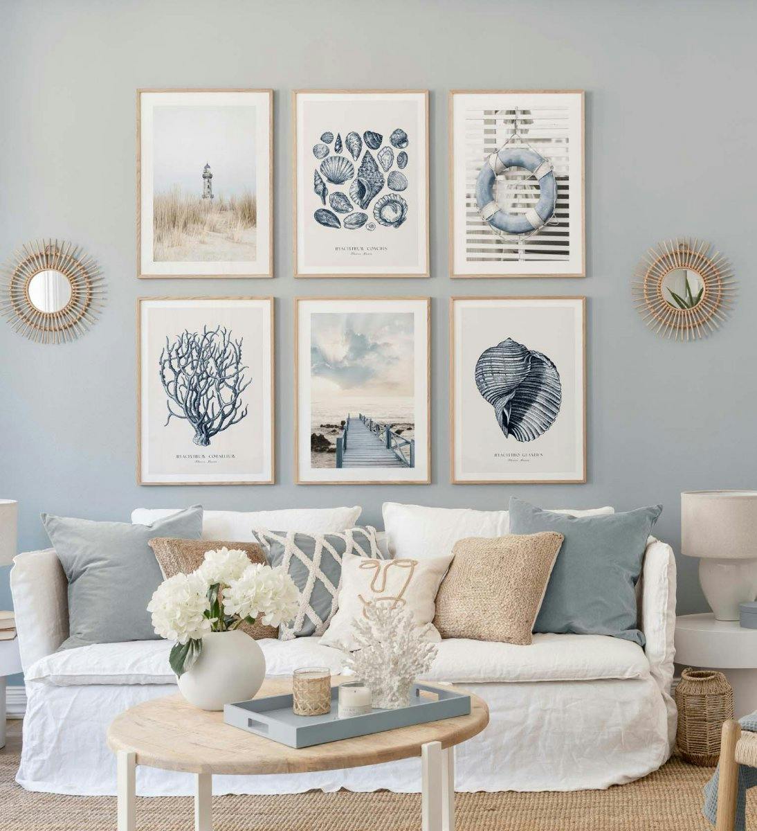 Blue and beige gallery wall with beach and sea prints with oak frames for living room