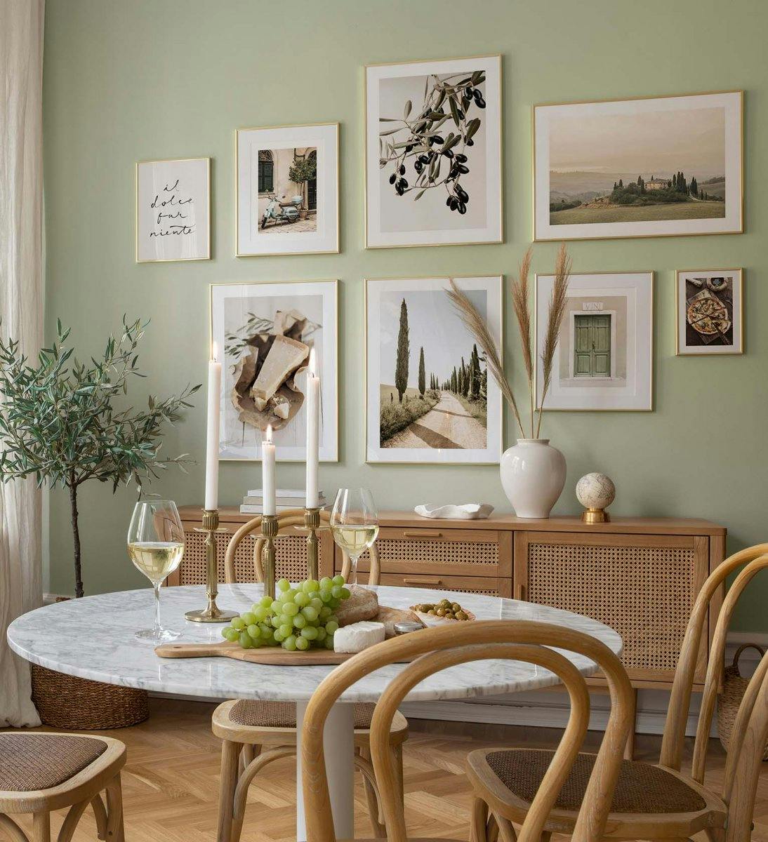 Green landscape gallery wall with golden frames for dining room