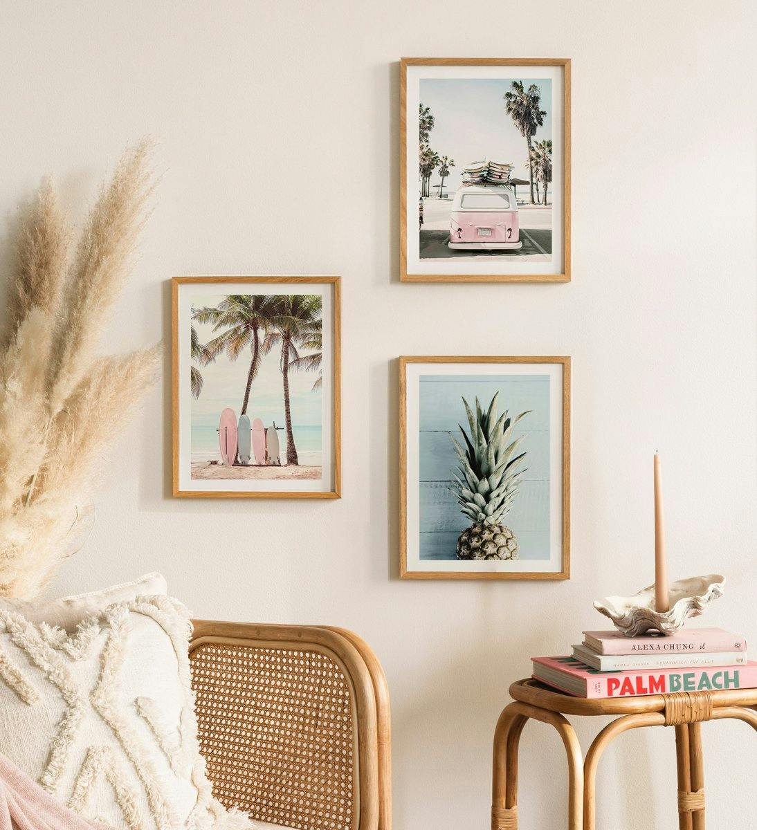 Holiday gallery wall with beach palm and fruit prints with oak frames for living room